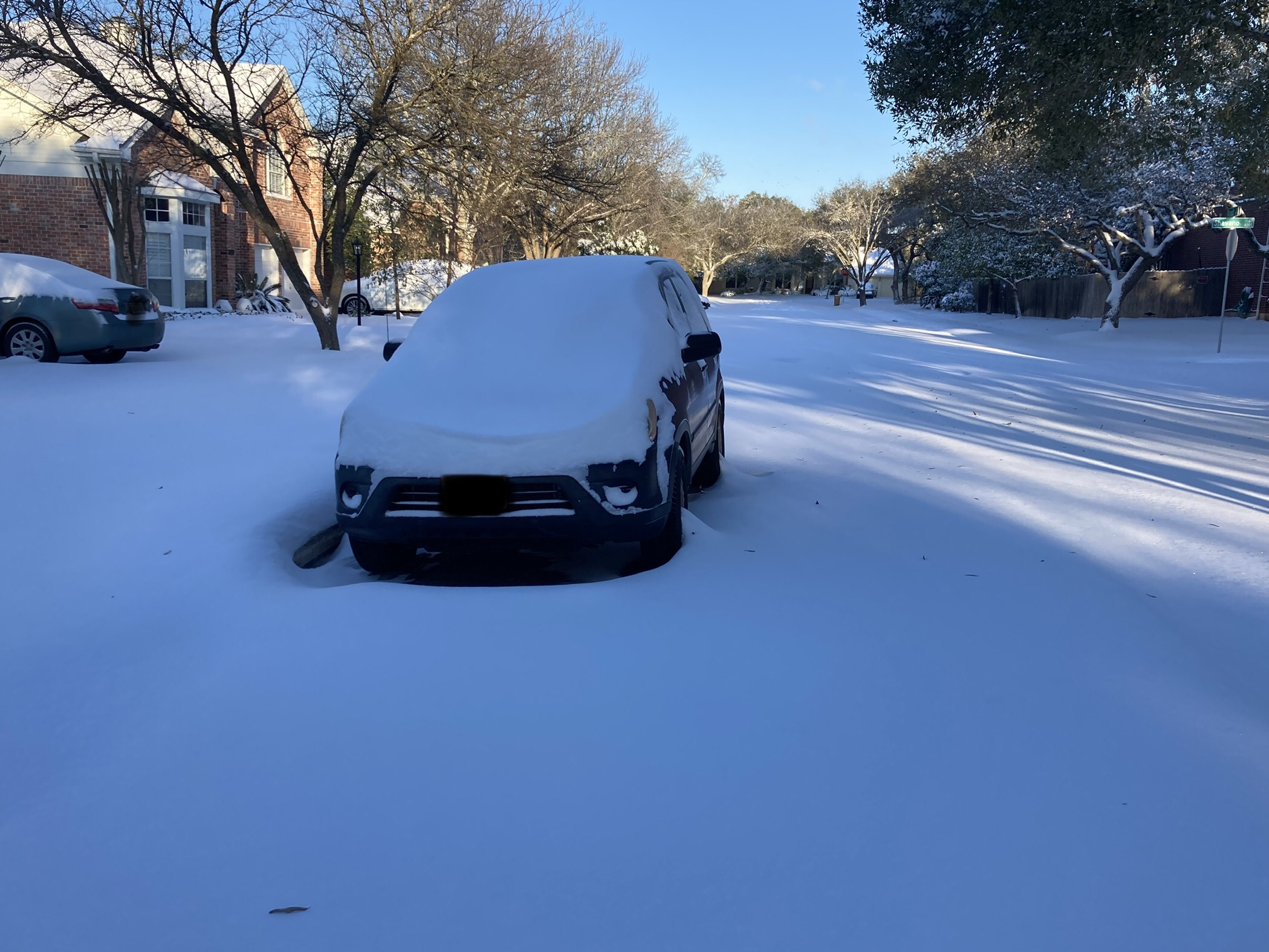 Car covered in snow.